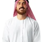 a man wearing a red and white headdress